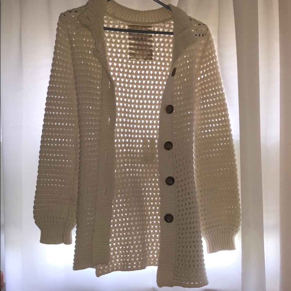 A knit cardigan with buttons and a knit belt